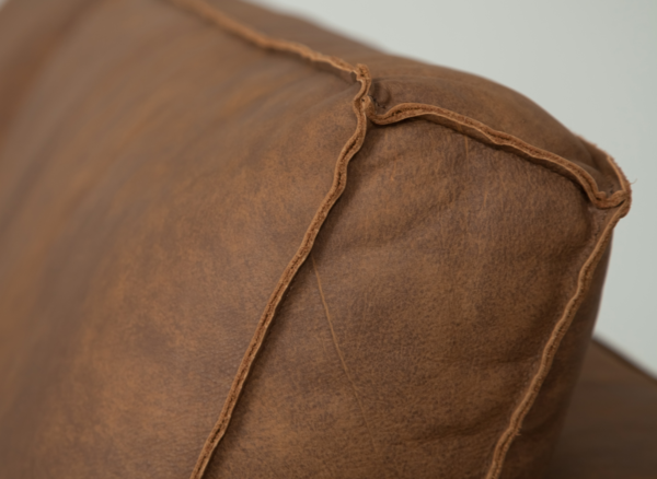 Couch LAVARE | Detailed view of the open seam on the back cushion | brown leather