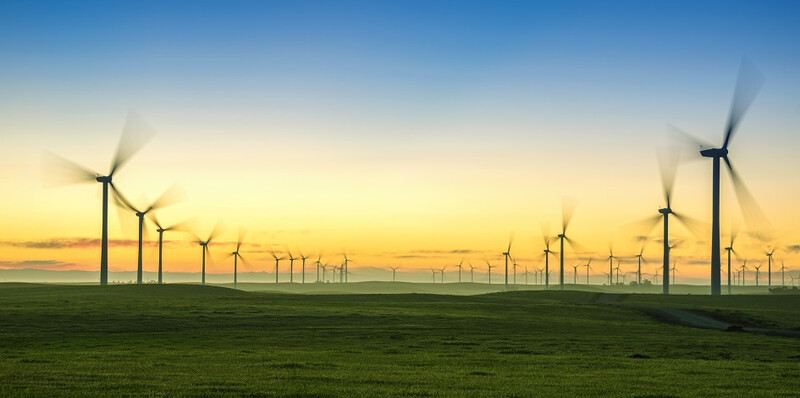 Sunrise-With-Wind-Turbines-and-Green-Grass