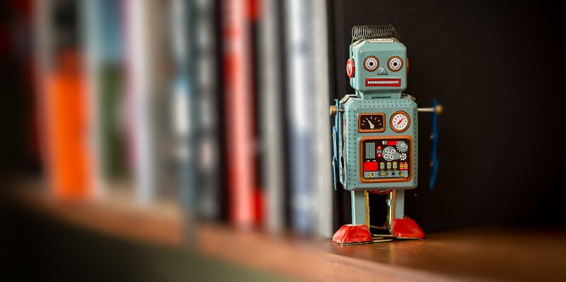 Vintage-tin-toy-robot-on-a-book-shelf