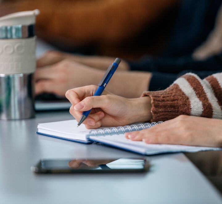 Student writing notes