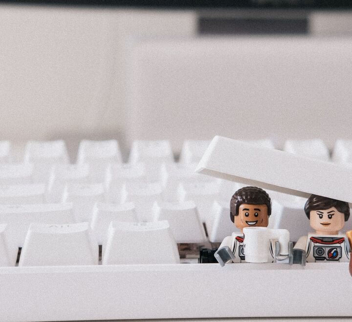 Lego figures under a  keyboard button
