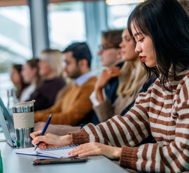Students during a lecture in an auditorium