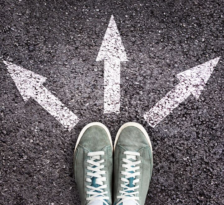 Shoes and arrows pointing in three directions