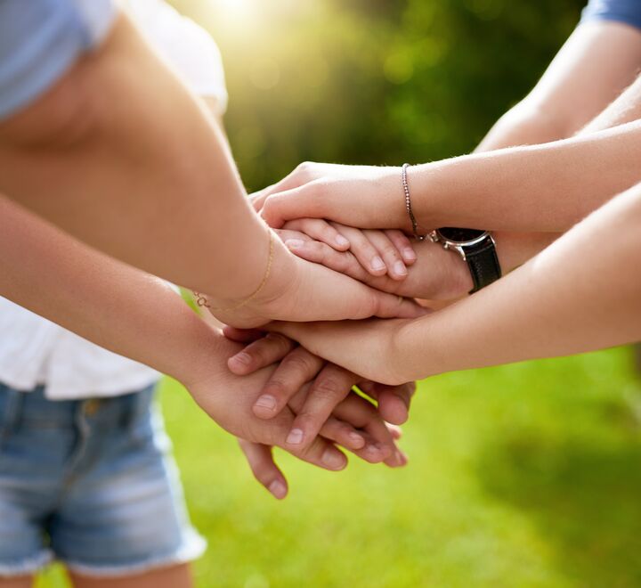 People putting their hands together