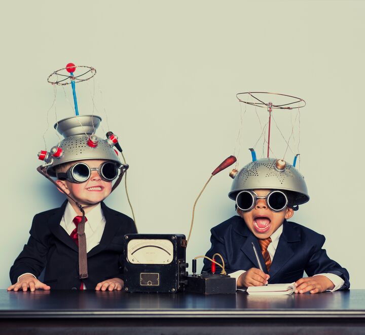 Two children with crazy hats and sunglasses