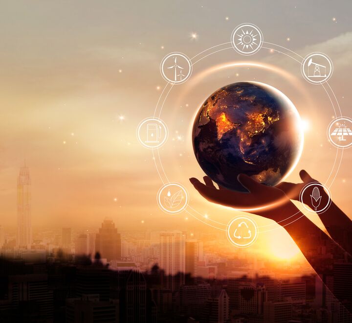 Earth surrounded by various symbols referred to energy