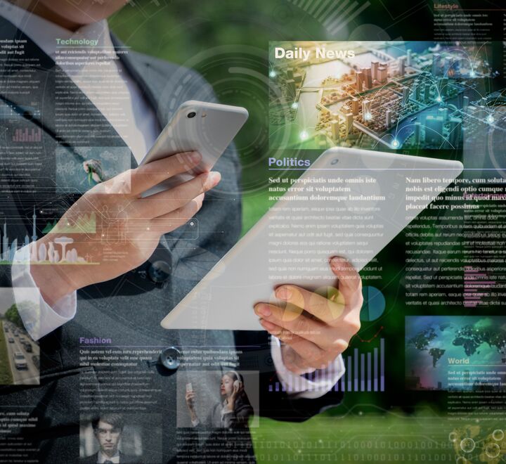 Illustration: man holding an iPad and a phone