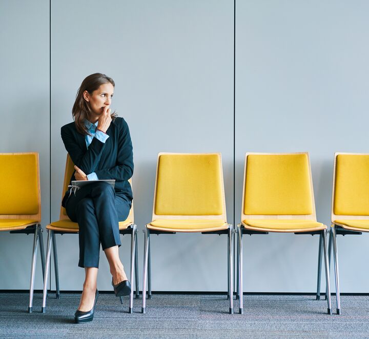 Stressful young woman waiting for job interview