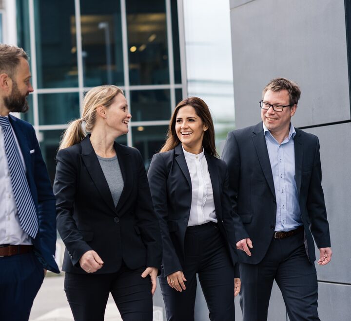 Smiling business people walking