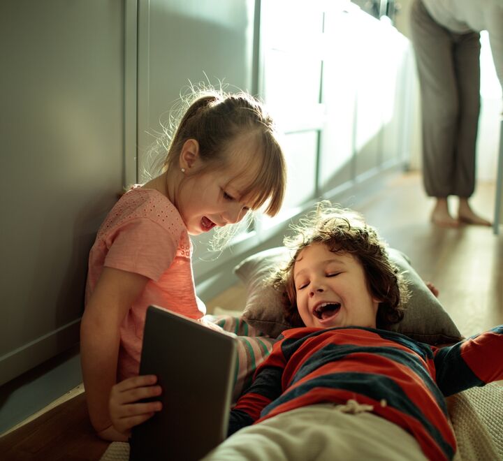 Our everyday lives is becoming more and more digitised (kids on tablet pictured). 