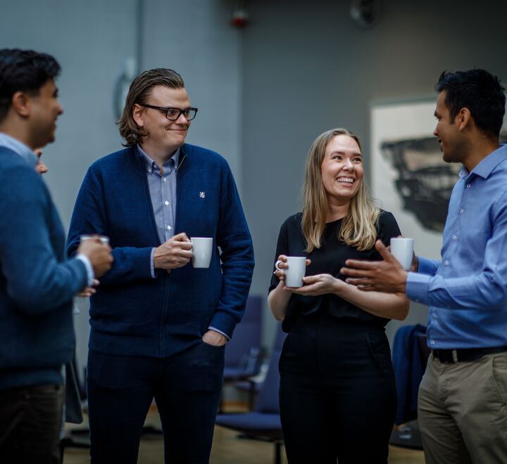 Four people mingling