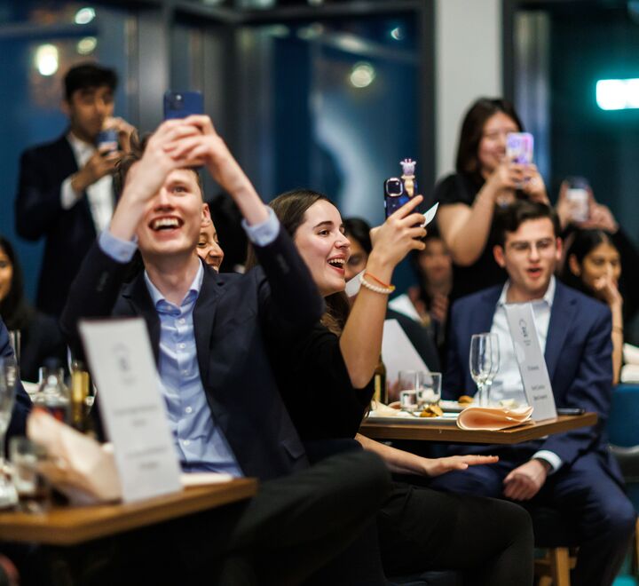 The award dinner from BIICC 2025. Students celebrating.
