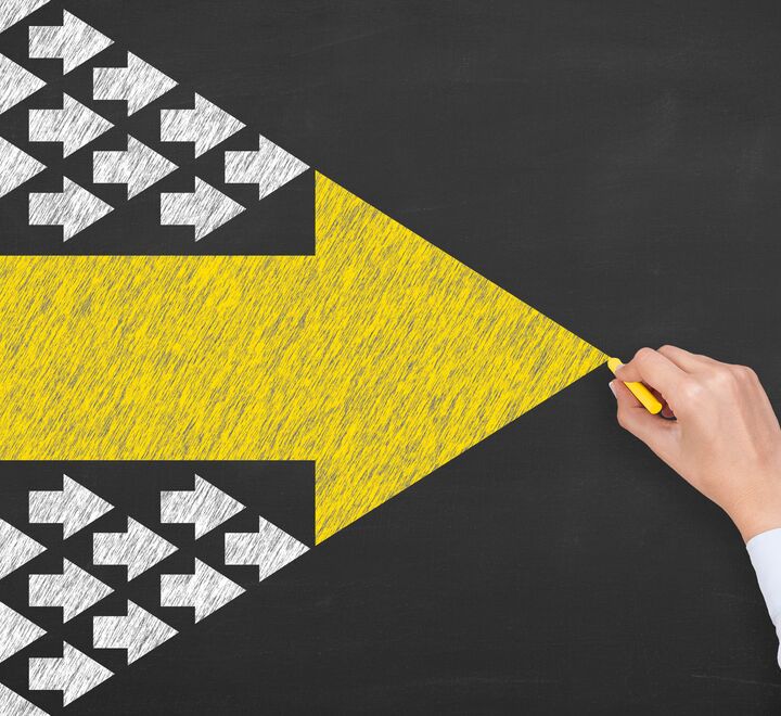 Yellow arrow on black background