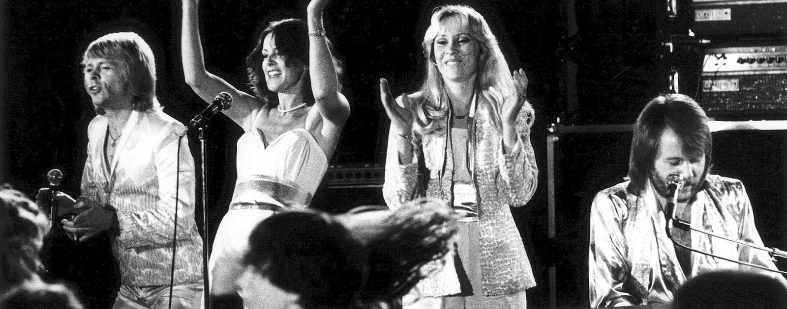 Black and White image of ABBA performing on stage