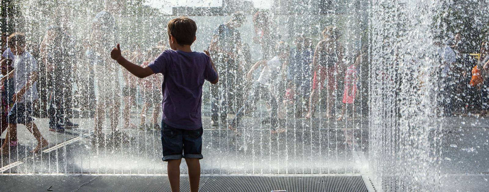 Jeppe Hein's Appearing Room Fountains Children jumping in Jeppe Hein's Appearing Room Fountains