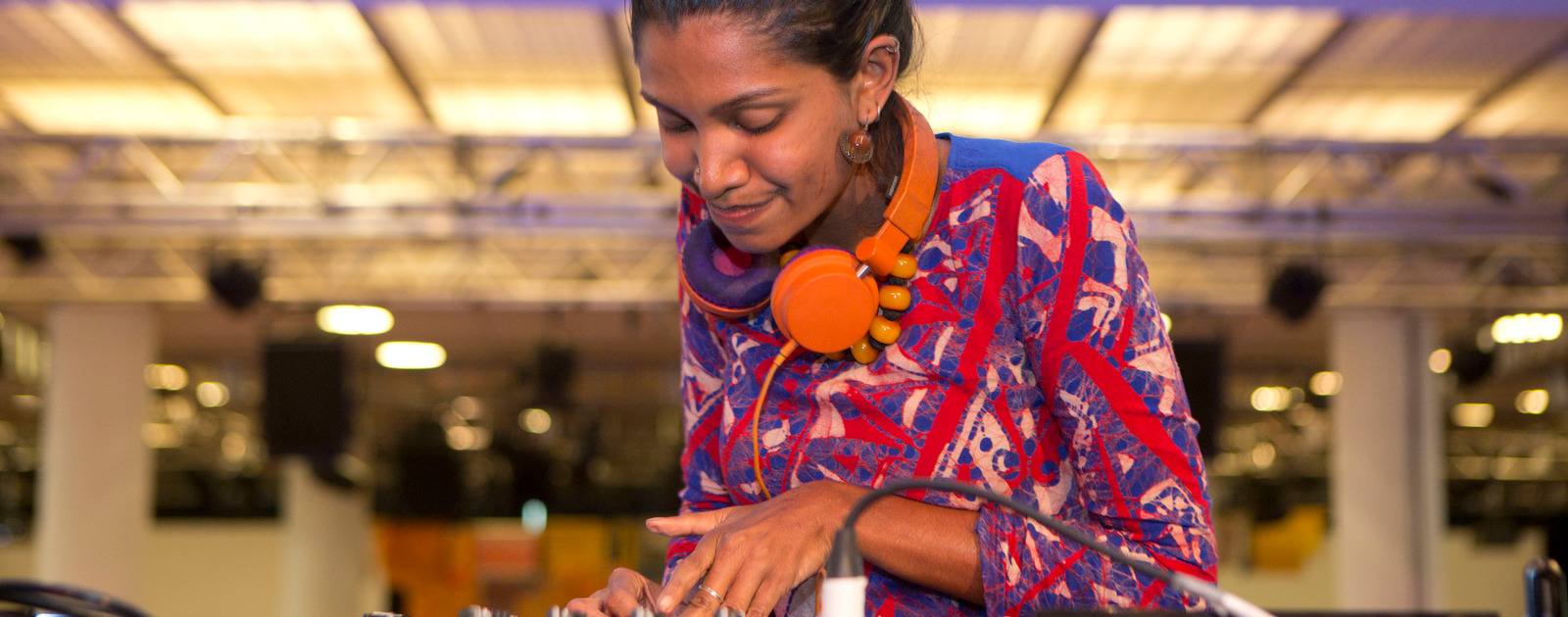 DJ at Alchemy festival Credit Belinda Lawley Female DJ playing at Alchemy Festival