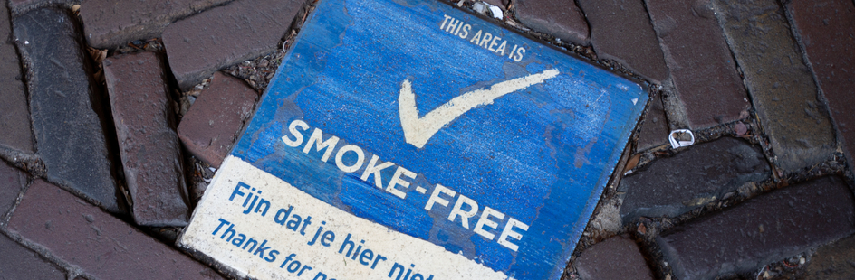 sidewalk tile with smoke-free sign