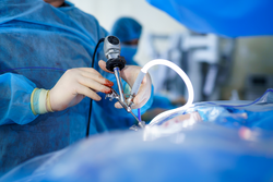 Special tube for operation. Neurosurgery equipment in hands of experienced doctor. Selective focus. Cropped photo.