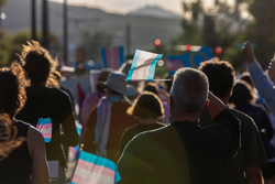 Marchers waving Trans Support flags at a visibility rally