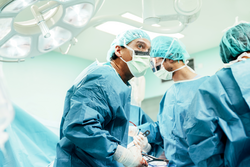 Team of Surgeons Operating in the Hospital.
