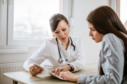 female doctor giving advice to a female patient. 