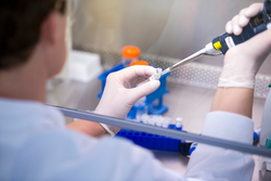Male scientist experimenting on infectious disease in laboratory