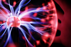 Plasma ball lamp energy, hand touching glowing glass sphere concept for power, electricity, science and physics