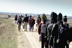 Abstract, blurry, out of focus image for media and internetа. A group of unorganized people are trying to illegally cross the border.