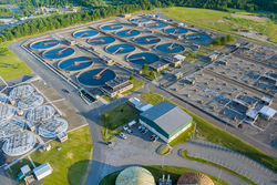 Modern urban wastewater treatment plant water purification is the process of removing undesirable chemicals of panoramic aerial view