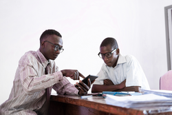 Two young African black university students working on their project