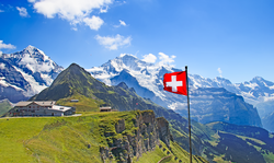 Swiss flag on the top of Mannlichen (Jungfrau region, Bern, Switzerland)